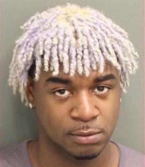 A Man With Dreadlocks On His Head Is Shown In This Mugshot Photo