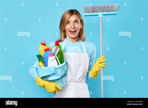 Smiling Surprised Shocked Blonde Woman In Yellow Rubber Gloves Holding