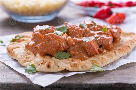 Butter Chicken Curry Served on Naan 813189 Stock Photo at Vecteezy