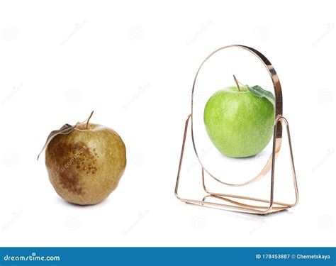 Spoiled Apple And Mirror With Reflection On Background Stock Image