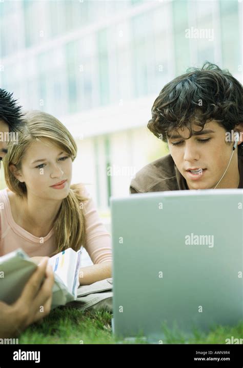 Students Studying Together On Grass Stock Photo Alamy