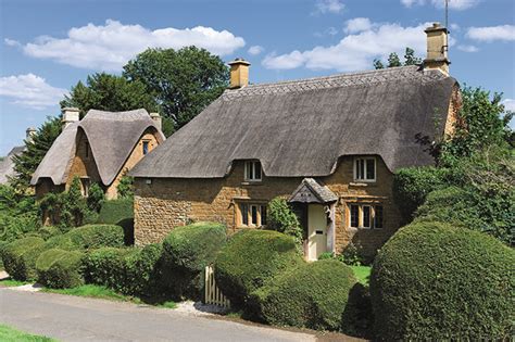 Thatched Cottages In The Cotswold Village Of Great Tew Oxfordshire