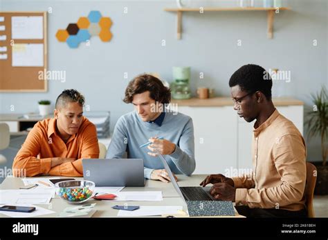 Portrait Of Diverse Business Team Using Laptops In It Development