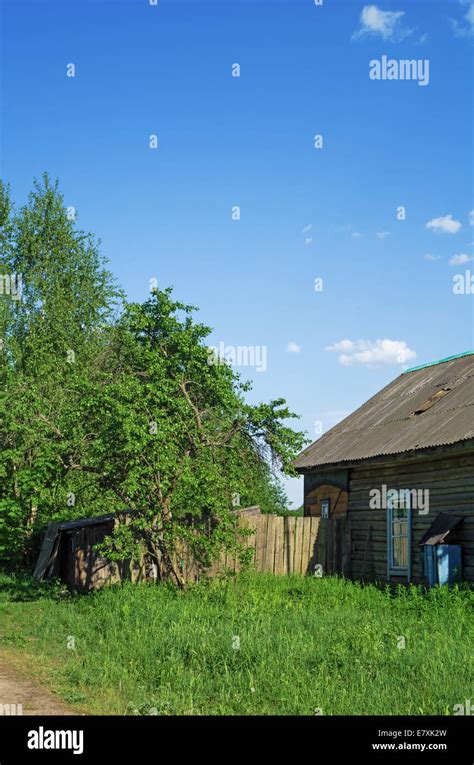 House and garden in village Stock Photo - Alamy