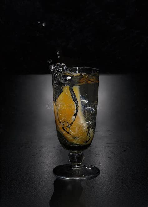 Glass With Liquid And Orange Slice Stock Image Image Of Dark Background 218421177