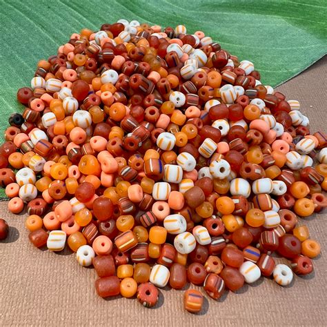 Indonesian Glass Loose Orange Mix Bead Goes On