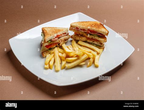 Club Sandwich With Spicy French Fries Stock Photo Alamy