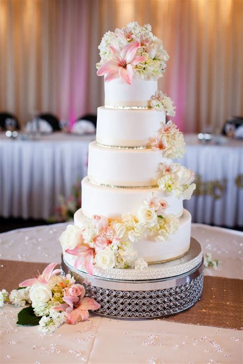 Five Tier White Fondant Cake With Cascading Flowers