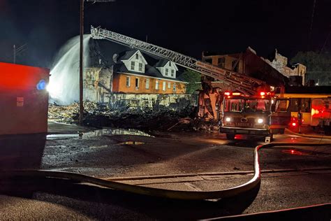 After Downtown Holly Fire Community Stands Vigil In Their Historic