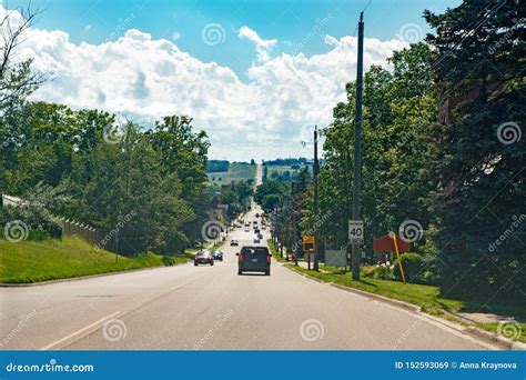 Landscape Midday View Of Canadian Ontario Country Side Road With Cars