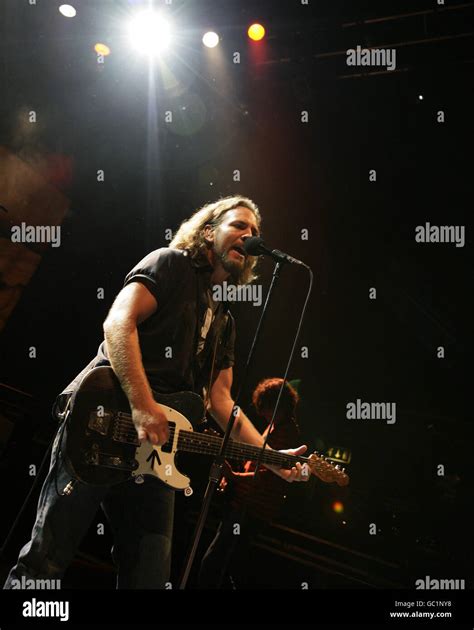 Pearl Jam, with lead singer Eddie Vedder, performing on stage at the O2