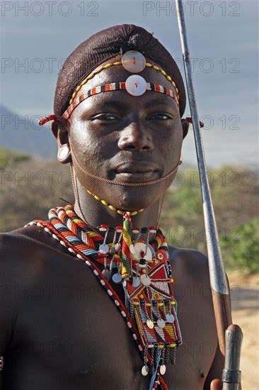 Portrait Of Samburu Warrior In Traditional Dress With Spear Photo