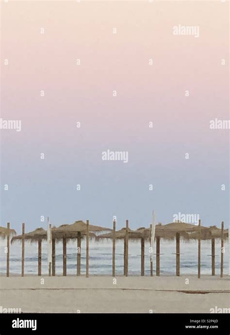 Sunset on an Algarve beach Stock Photo - Alamy