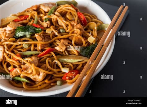 Wok Stir Fry Egg Noodles With Fried Chicken And Thai Spices And