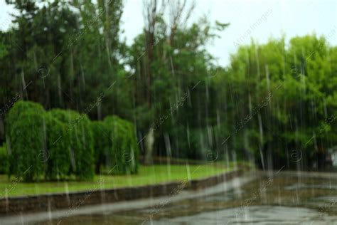 Blurred View Of Heavy Pouring Rain In Green Park Stock Photo