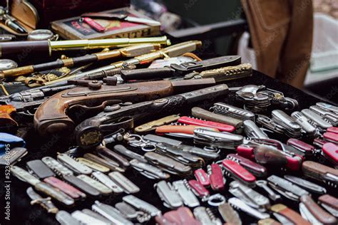 Collection Of Antique Weapons At The Flea Market Muskets And Edged Weapons Are Sold For Next To