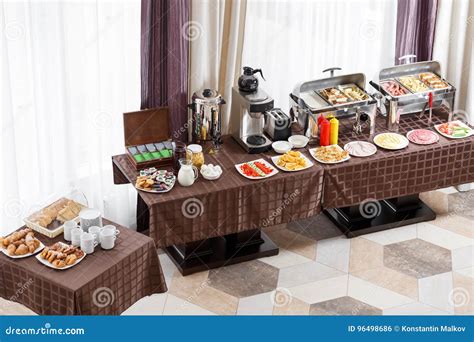 Breakfast At The Hotel. Buffet Table With Dishware Waiting For Guests ...