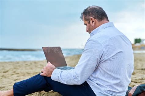 Serious Confident Mature Man With Laptop Outdoors Stock Image Image