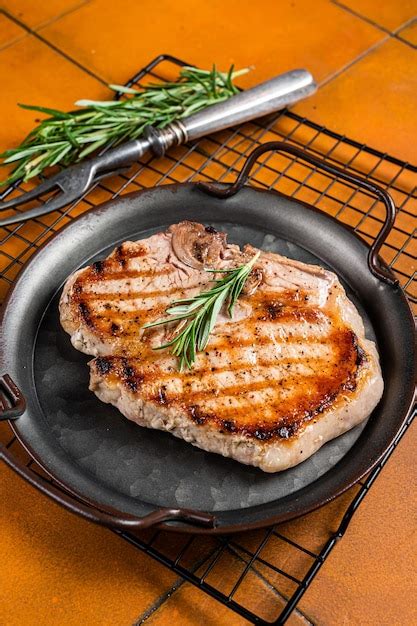 Premium Photo Grilled Pork T Bone Chop Meat Steak Orange Background