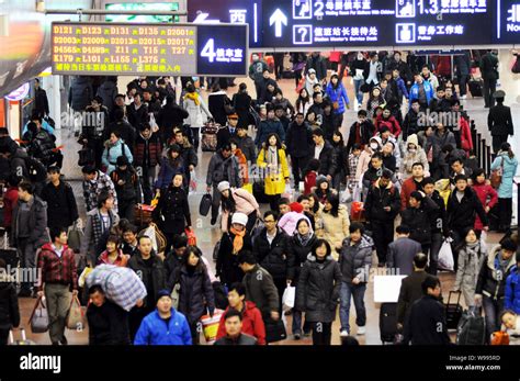 Chinese passengers crowd the Beijing West Railway Station during the ...