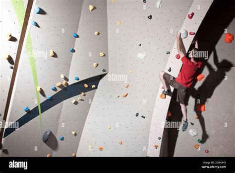 climber bouldering at indoor climbing wall in London Stock Photo - Alamy