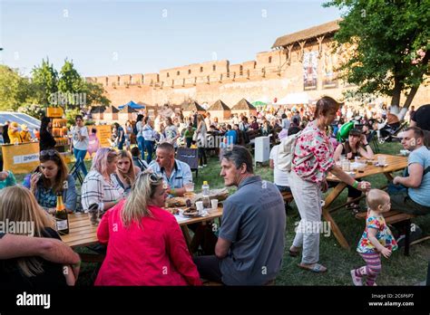 UKRAINE, LUTSK - June 20, 2019: People eating their food on a food fest