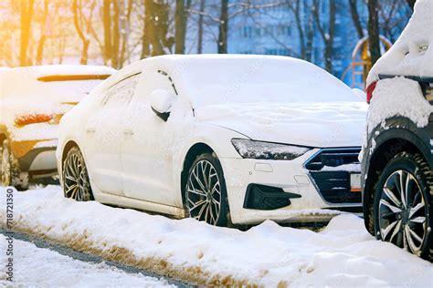 Row Of Cars Covered In Snow After Winter Storm Cars Buried In Snow