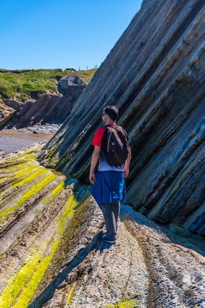 Premium Photo A Male Hiker Visiting The Flysch Basque Coast Geopark