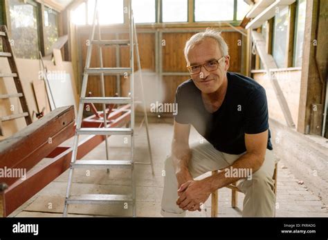 Portrait Confident Mature Man Sitting Workshop Hi Res Stock Photography And Images Alamy