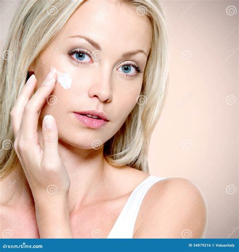 Beautiful Woman Applying Cream On Face Stock Photo Image Of Fresh