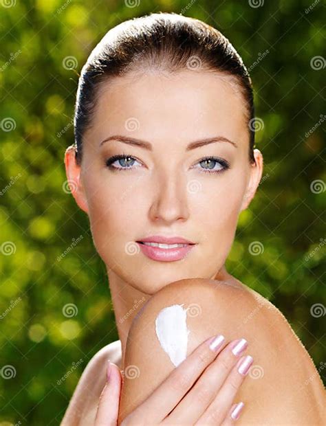 Beautiful Woman Applying Cream On Shoulder Stock Photo Image Of