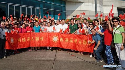 People Attend National Flag Raising Ceremony At Golden Bauhinia Square