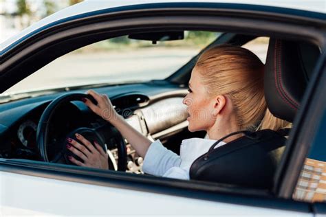 Beautiful Female Blonde Driver Behind The Wheel Of A Sports Car Stock Photo Image Of