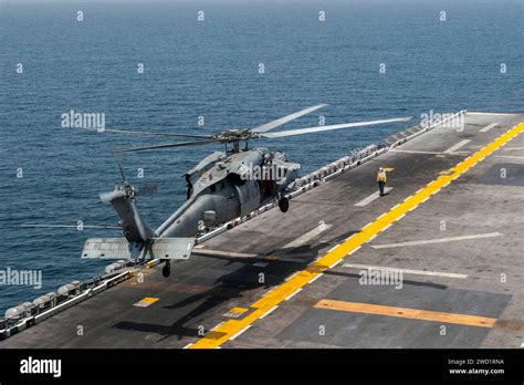 An MH 60S Sea Hawk Helicopter Lifts Off From The Flight Deck Of USS