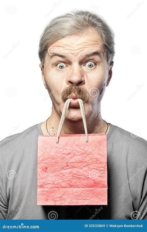 Surprised Mature Man With Shopping Bag In Mouth Isolated Stock Image