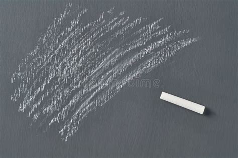 One White Piece Of Chalk On Black Chalkboard Stock Photo Image Of