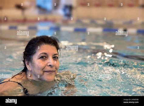 Portrait Of Mature Woman Swimming In Pool At Weekend Stock Photo Alamy