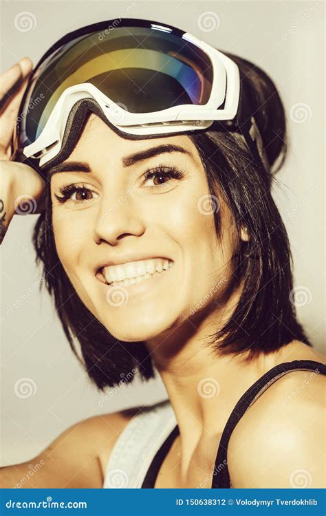 Pretty Smiling Happy Woman In Ski Goggles Or Safety Glasses Stock Photo