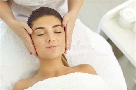 Facial Massage Hands Of Cosmetologist Massaging Relaxed Womans Face In