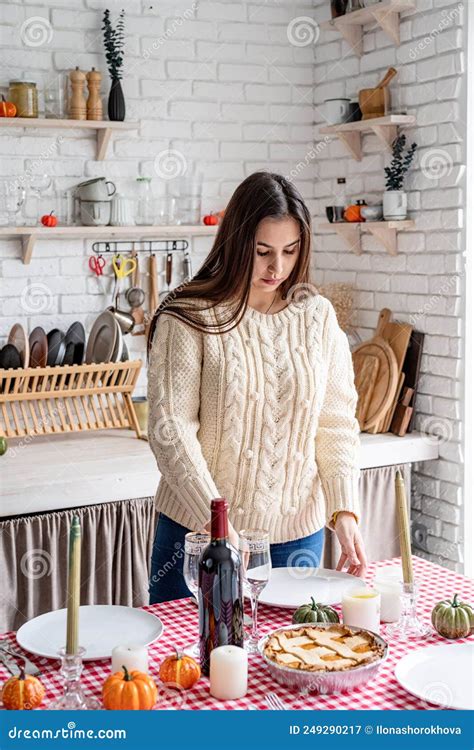 Portrait Of A Woman Preparing Thanksgiving Dinner At Home Kitchen Stock