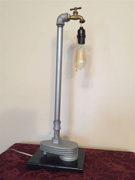 Lamp Made From Old Compressor Part And Plumbing Pipes Fixture Has An