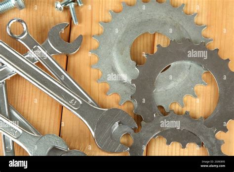 Machine Gear Metal Cogwheels Nuts And Bolts On Wooden Background