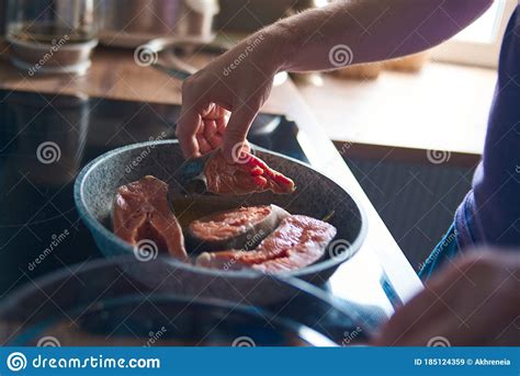 A Man Roasts Fish Stock Image Image Of Dining Slice 185124359