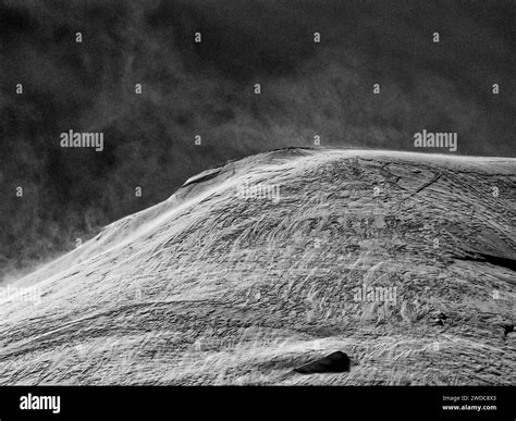 A Black And White Image Of A Mountain Ridge With Strong Texture And