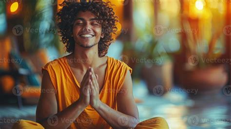 A Man Sitting Cross Legged With Eyes Closed Deep In Meditation