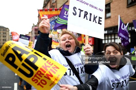 Demonstrators Hold Placards As They March For Equal Pay For Glasgow