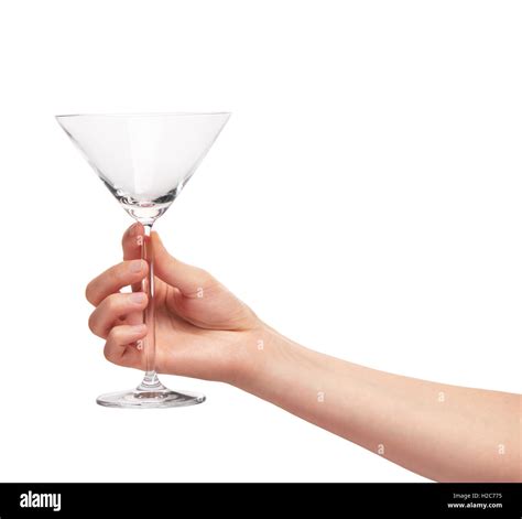 Close Up Of Female Hand Holding Empty Clean Transparent Martini Glass