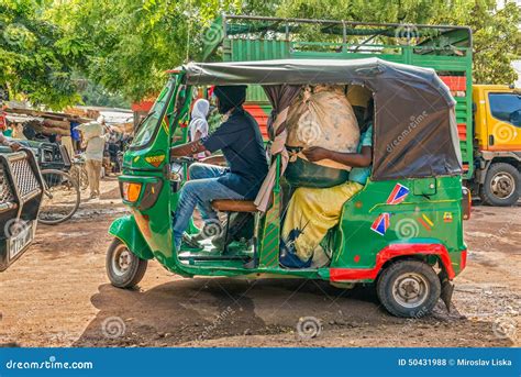 African Taxi Taking Customers From The Local Marketplace Editorial