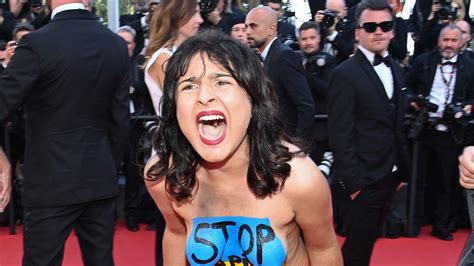 Topless Screaming Protester Removed From Cannes Red Carpet Photos