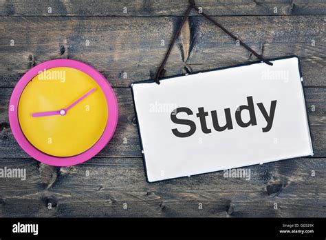 study sign  clock  wooden table stock photo alamy